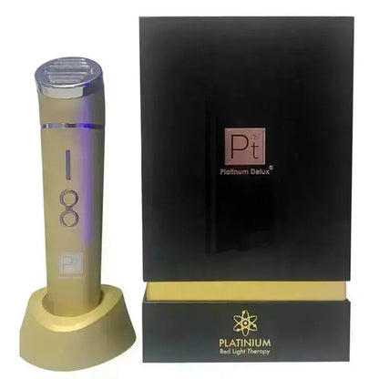Gold colored red light therapy device with black packaging featuring 'Platinum Delux' logo on a white background.