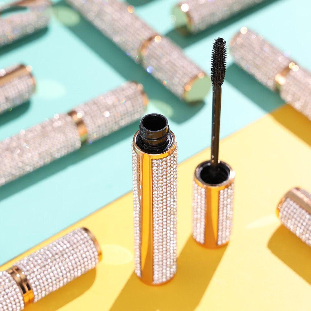 Dr.  Liia Mascara with rhinestone casing on a colorful background