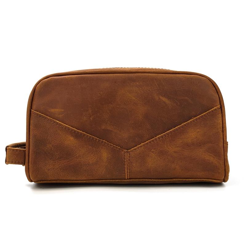 Brown leather toiletry bag on a white background