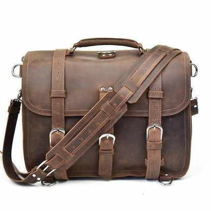 Brown leather satchel bag with strap on a white background