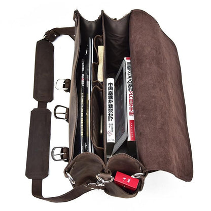Brown leather bag with various items inside on a white background