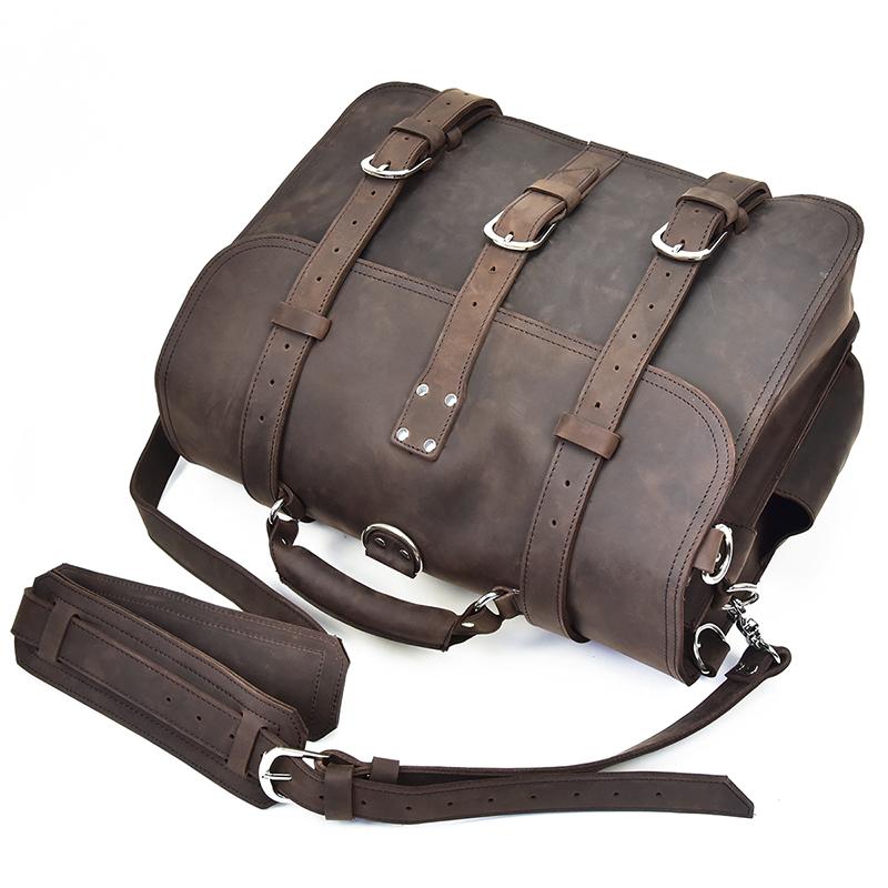 Brown leather bag with straps on a white background