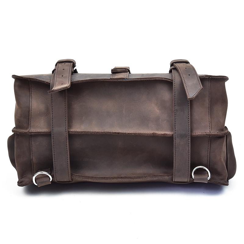 Brown leather duffel bag with straps on a white background