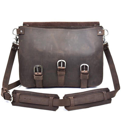 Brown leather bag with straps on a white background
