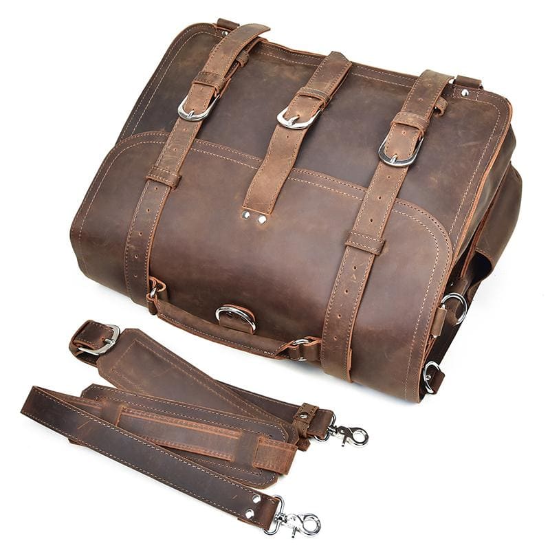 Brown leather bag with straps on a white background