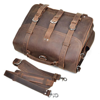 Brown leather bag with straps on a white background
