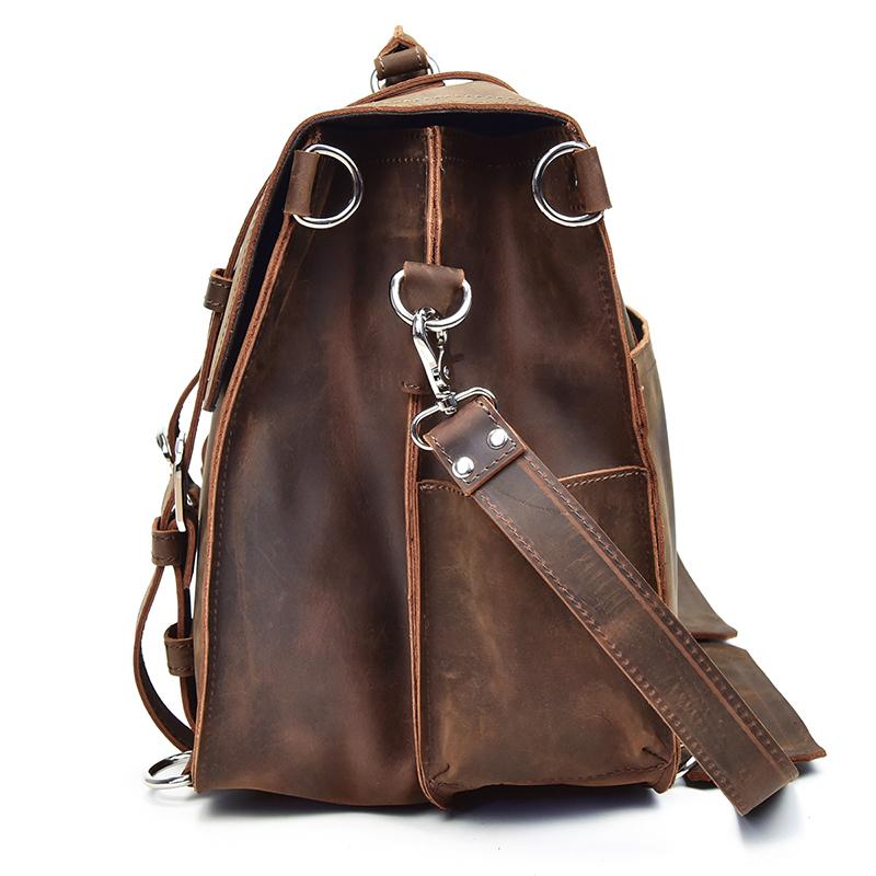 Brown leather backpack with shoulder strap on a white background