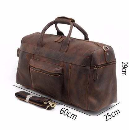 Brown leather duffel bag with measurements on a white background