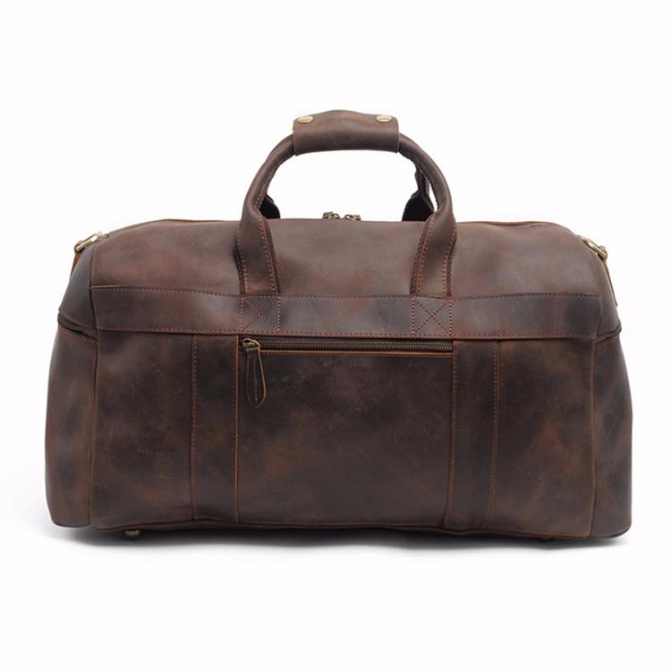 Brown leather duffel bag on a white background