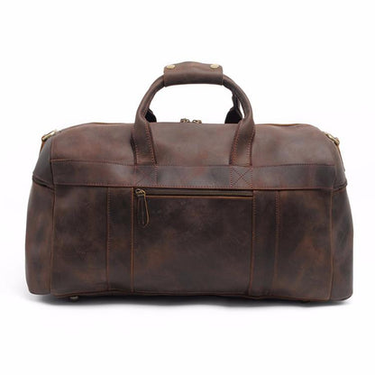 Brown leather duffel bag on a white background
