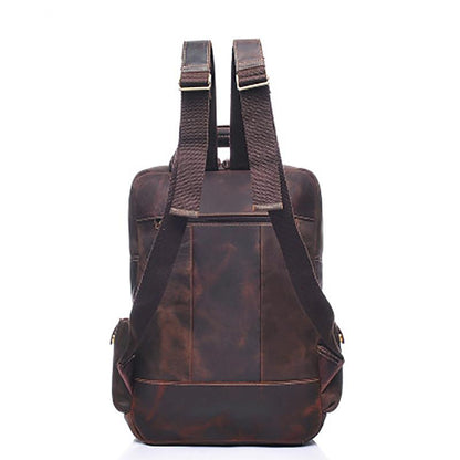 Brown leather backpack, back view on a white background