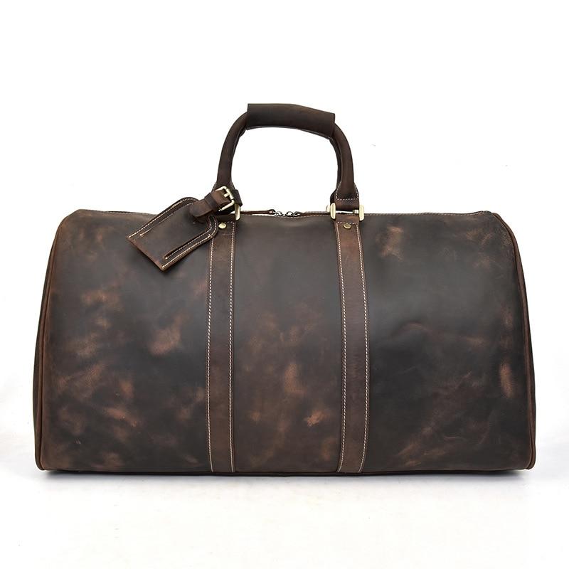 Brown leather duffel bag on a white background