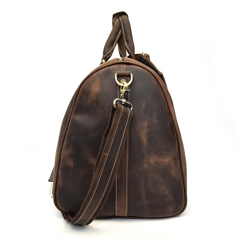 Brown leather duffle, side view on a white background