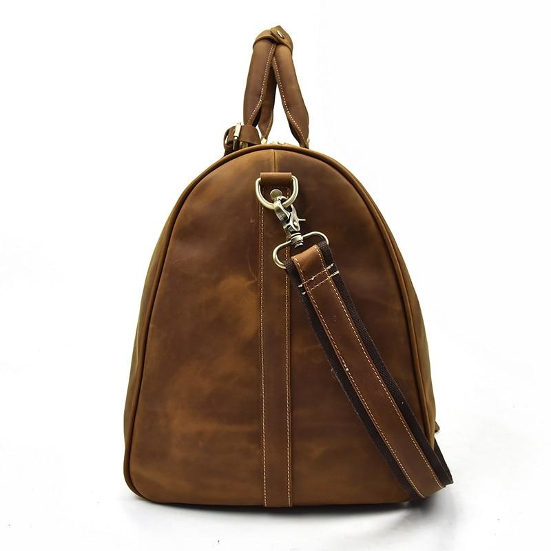 Brown leather backpack with a strap on a white background