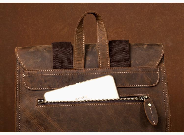 Brown leather briefcase with a zipper on a brown background