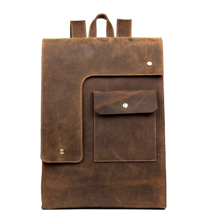 Brown leather backpack with a front pocket on a white background