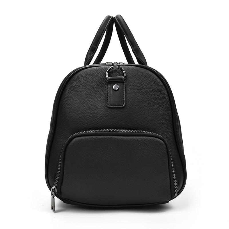 Black leather duffel showing shoe compartment on a white background