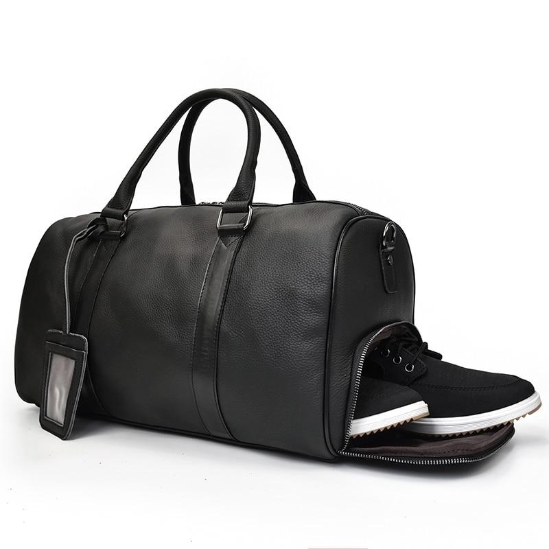Black leather duffel bag with a shoe compartment on a white background