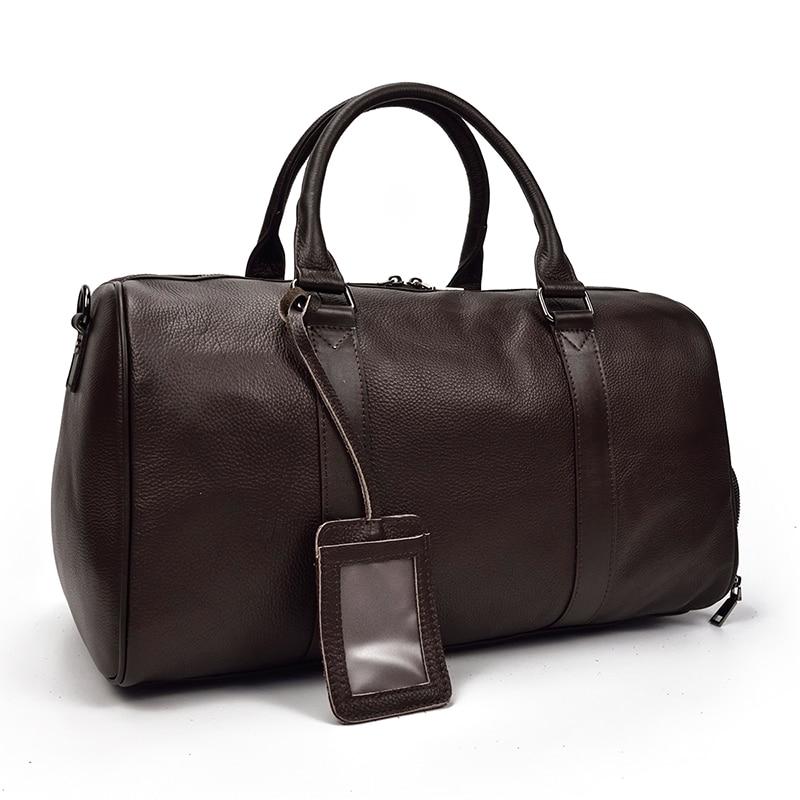 Brown leather duffel bag with a clear tag on a white background