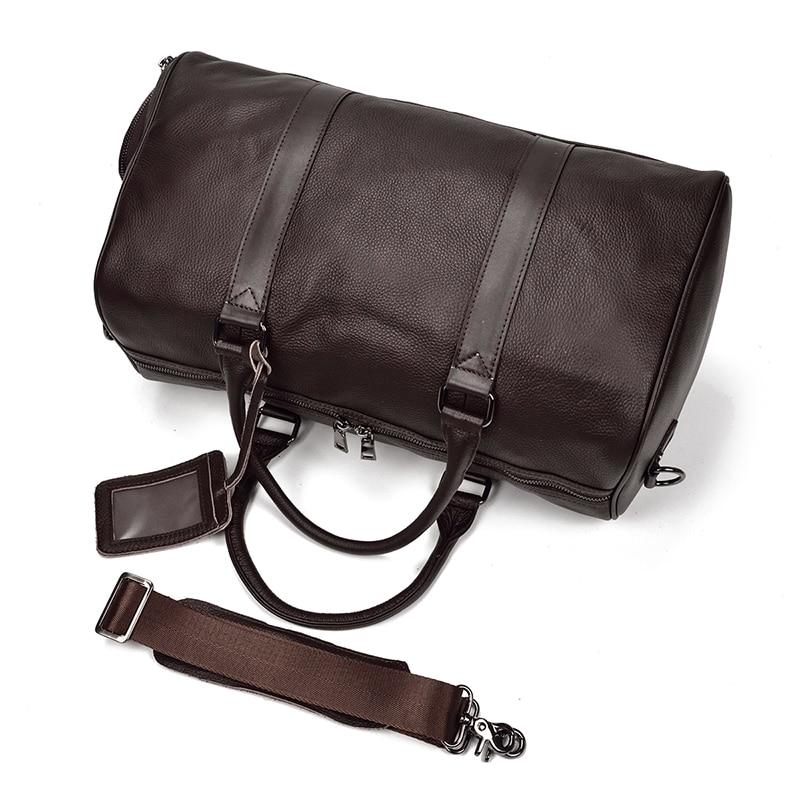 Brown leather duffel bag with a strap on a white background