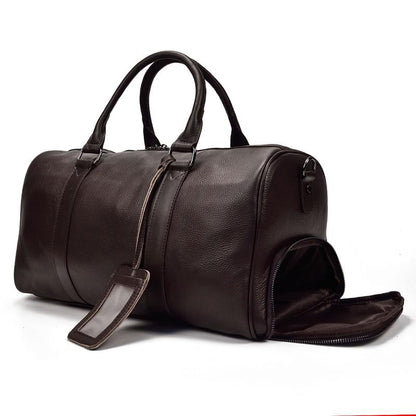 Brown leather duffel bag on a white background