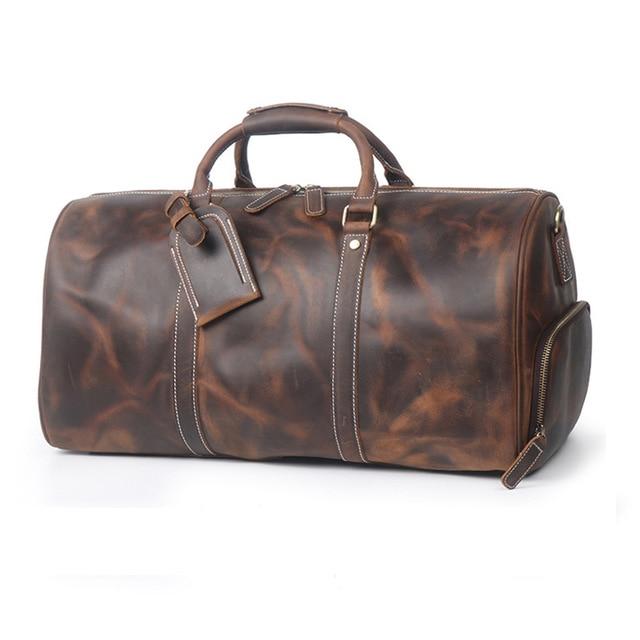 Brown leather duffel bag on a white background