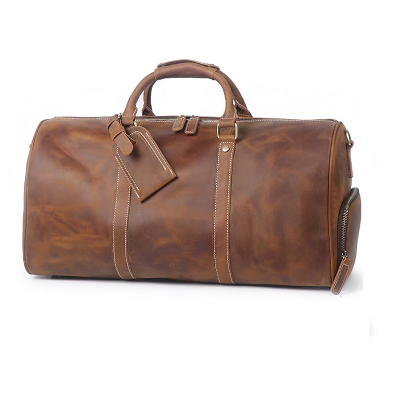Brown leather duffel bag on a white background