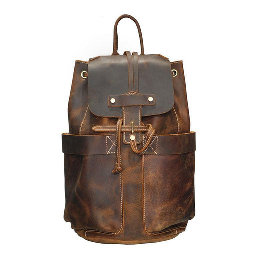 Brown leather backpack on a white background