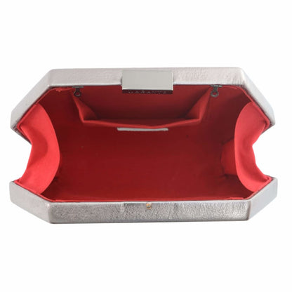 Silver clutch with red interior on a white background