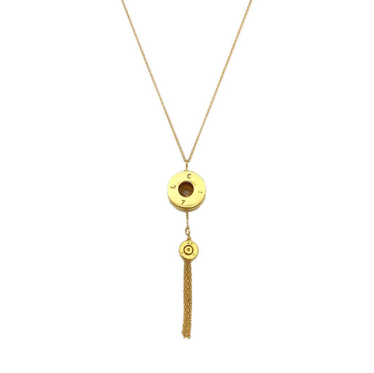 Gold necklace with circular pendants and a tassel on a white background