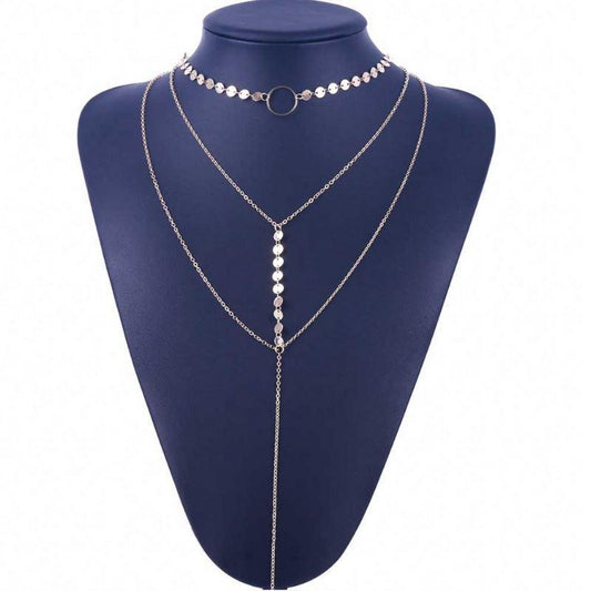Silver necklace on a blue mannequin bust